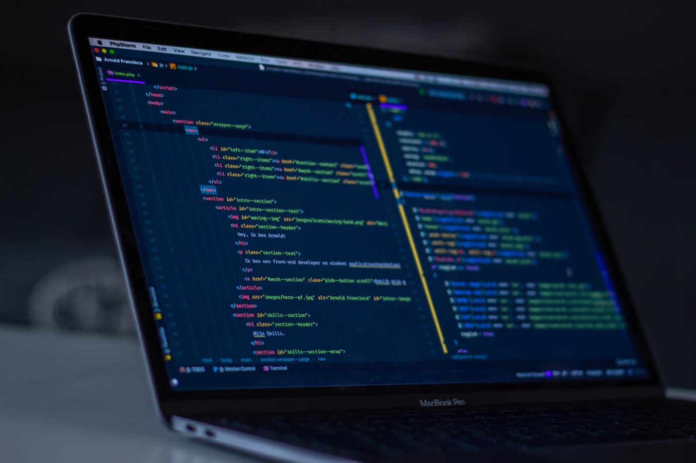 Source code open in an editor on a laptop screen